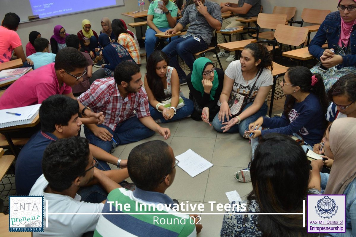 Teens collaborating in a circle