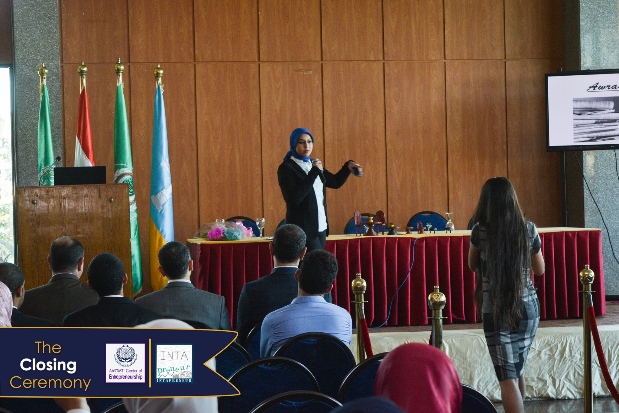 A student pitching on stage